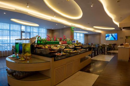 a buffet line in a hotel with a lot of food at Grand Bellevue Hotel Apartment Dubai in Dubai