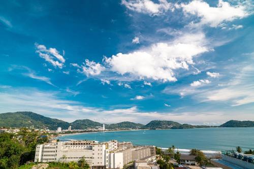 a view of a city and a body of water at Patong Kalim Unparalleled Sea View B&B Resort in Patong Beach