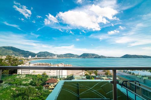 a view of the water from a balcony at Patong Kalim Unparalleled Sea View B&B Resort in Patong Beach