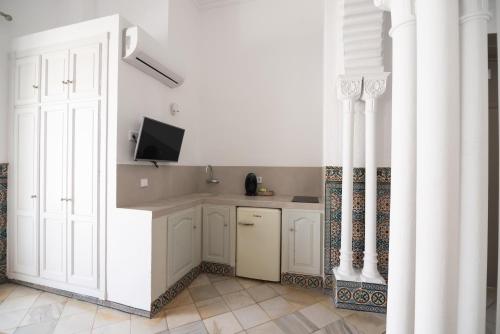 Kuchyň nebo kuchyňský kout v ubytování Apartahotel Siglo XIX