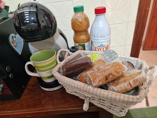 a basket of bread sitting on a counter next to a blender at B&B da Giovy in Marsala