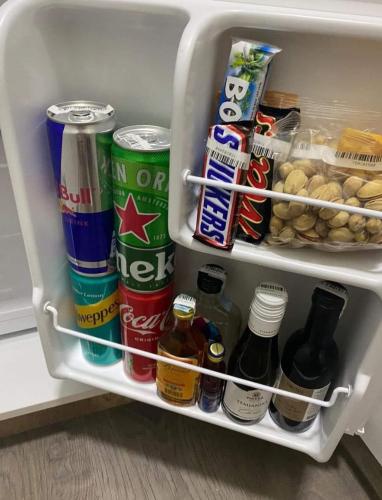 an open refrigerator filled with lots of food and drinks at Villa Ristovski in Ohrid