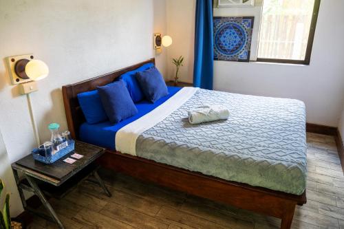 Postel nebo postele na pokoji v ubytování Island Lyfe Adventures Hotel