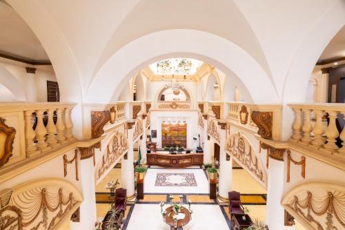 an aerial view of the lobby of a house with a staircase at Mövenpick Hotel Jeddah in Jeddah