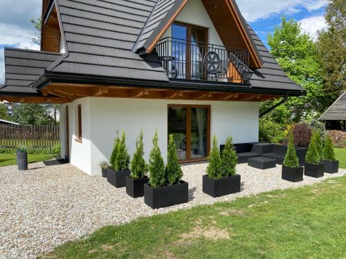 Un jardín fuera de RELAS - przytulny domek z dwoma sypialniami i antresolą