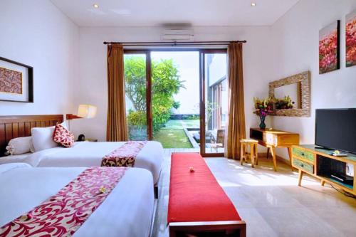 Ένα ή περισσότερα κρεβάτια σε δωμάτιο στο Laura 2 BR Beachfront Villa JU29