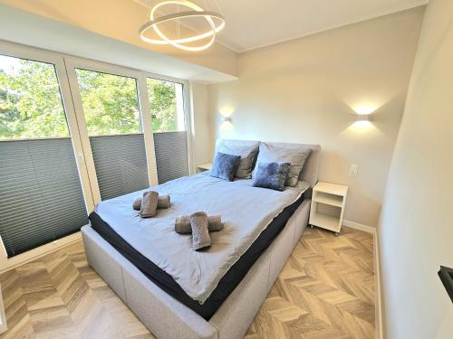 Cama o camas de una habitación en M&K Apartamenty Przystań Świbno