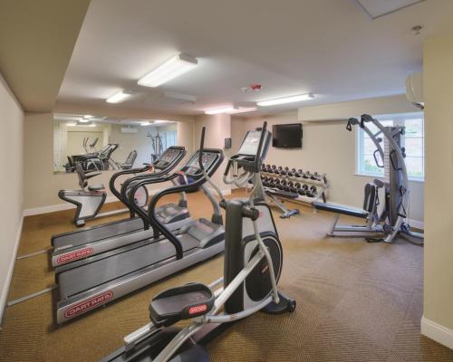 a gym with treadmills and elliptical machines at The Residences at Biltmore - Asheville in Asheville
