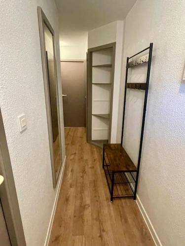 a hallway with a mirror and a dressing room at SAS Vac Appart in Talmont