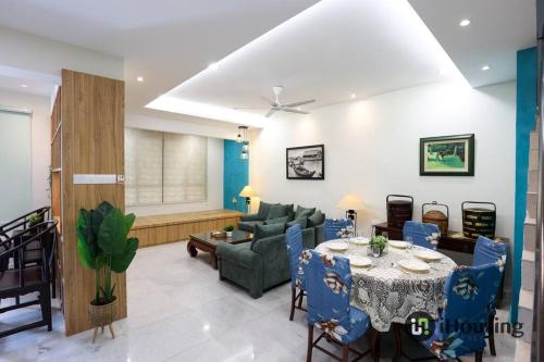 a living room with a table and a couch at Klebang Modern Classic Chill House Melaka By I Housing in Melaka