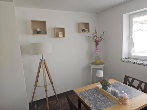 a dining room table with a tripod and a camera at Feierabend Elsdorf in Elsdorf