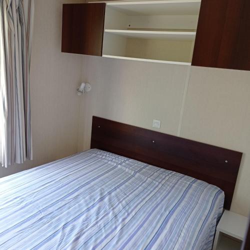 Ένα ή περισσότερα κρεβάτια σε δωμάτιο στο Mobil home chez Sophie