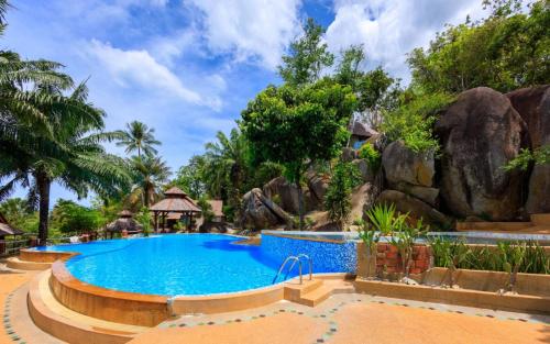 a pool at the resort at Samui Wooden Hill Resort in Lamai