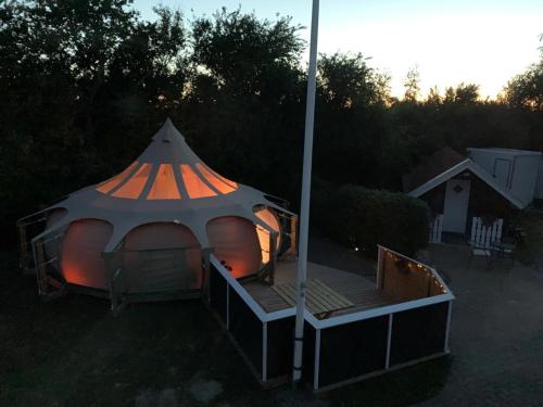a gazebo with a tent in a yard at Romantic Luxus Glamping 1 in Idestrup