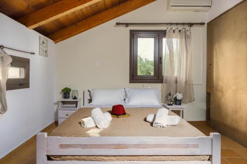 a bedroom with a large bed in a room at The House of Love in Tragaki