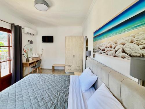 Un dormitorio con una cama y una pared con ovejas. en ATHANASIA APARTMENTS en Skiathos