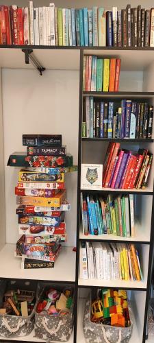 a book shelf filled with lots of books at Cieślówka in Leżajsk