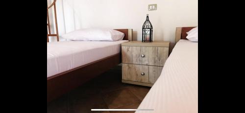Una cama o camas en una habitación de Flutura Apartments