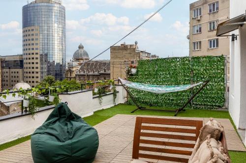 a hammock on the roof of a building at SkyCentral Bucharest in Bucharest