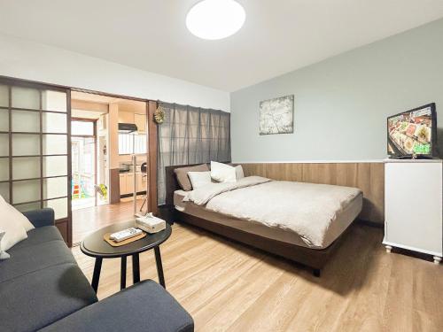 Cama ou camas em um quarto em 天下茶屋駅5分、専用庭付き平屋—KIK Iハウス