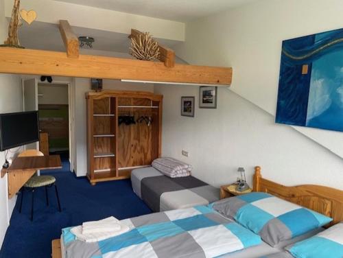 a bedroom with two beds and a bunk bed at Apartment Bea in Schladming