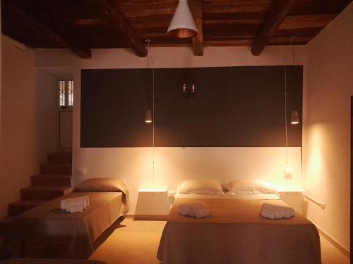 En eller flere senge i et værelse på B&B il Palazzo Cirella