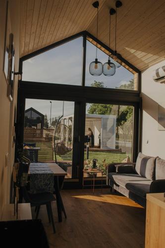 a living room with a large sliding glass door at Chce się być in Ślesin