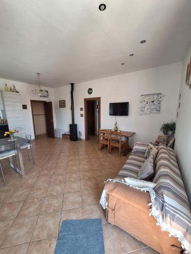 a living room with a couch and a table at La casa dì Nonno in Pelago