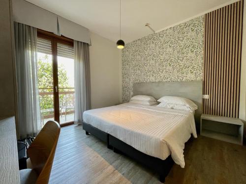 Postel nebo postele na pokoji v ubytování B City Hotel
