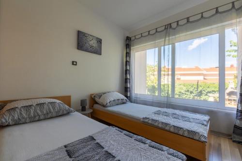 Postel nebo postele na pokoji v ubytování Apartment Vidak