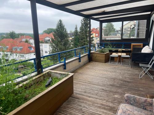 a balcony with a table and chairs on a building at Hotel Hages in Bad Salzuflen