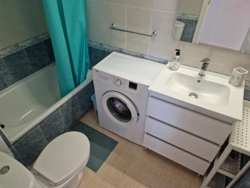 a bathroom with a washing machine and a sink at Apartment Bella Vista with sea view in Dehesa de Campoamor