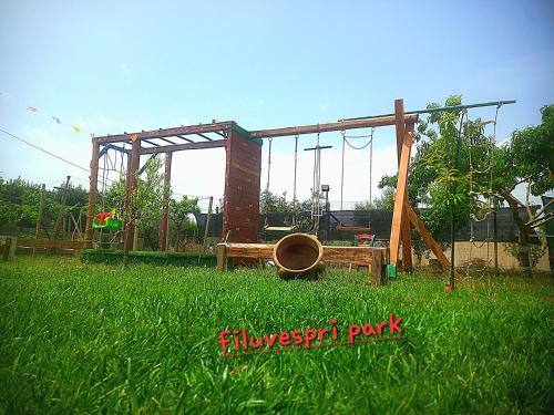 a playground in a field of green grass at Filuvespri in Comiso