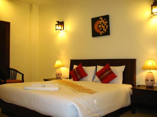 Ein Bett oder Betten in einem Zimmer der Unterkunft Wannara Hotel Hua Hin