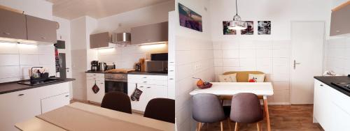 a small kitchen with a table and chairs in it at Ferienwohnungen Auszeit am Geiseltalsee in Stöbnitz