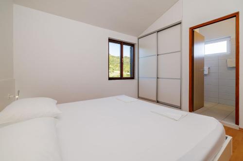 Katil atau katil-katil dalam bilik di Apartments Biserka