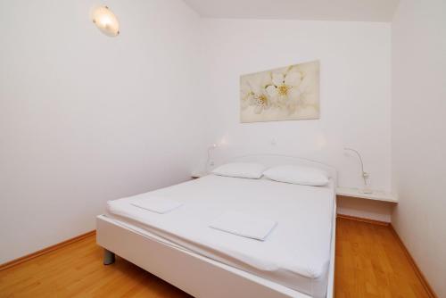 Katil atau katil-katil dalam bilik di Apartments Biserka