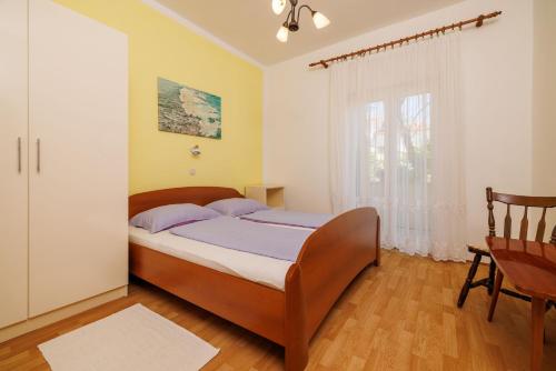 Postel nebo postele na pokoji v ubytování Apartments Darko