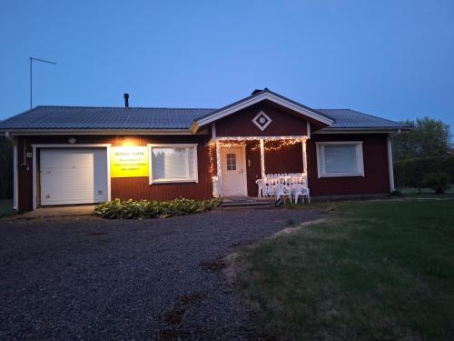a house with christmas lights on the front of it at Sunin Tupa in Rantsila