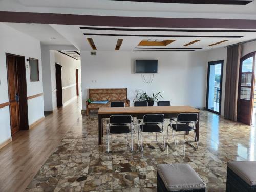 a dining room with a table and chairs at MANGORO HOTEl in Moramanga
