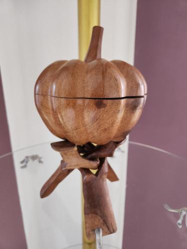 a wooden bowl on a stand on a wall at MANGORO HOTEl in Moramanga