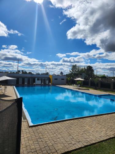 a large blue swimming pool on top of a building at MANGORO HOTEl in Moramanga