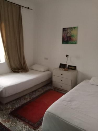 Ένα ή περισσότερα κρεβάτια σε δωμάτιο στο Magnifique petite villa a 1 min de la plage