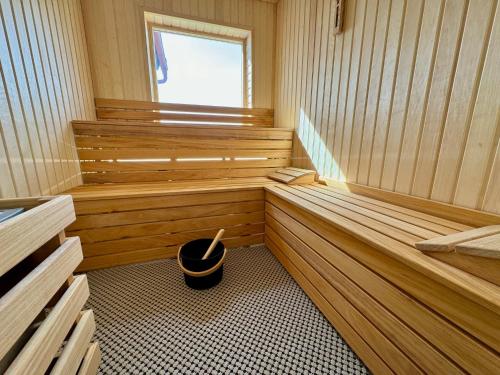 a sauna with a bucket in the middle of the room at Holiday Home Celine in Velké Svatoňovice