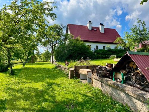 a house with a yard with a pile of fire rubble at Holiday Home Celine in Velké Svatoňovice