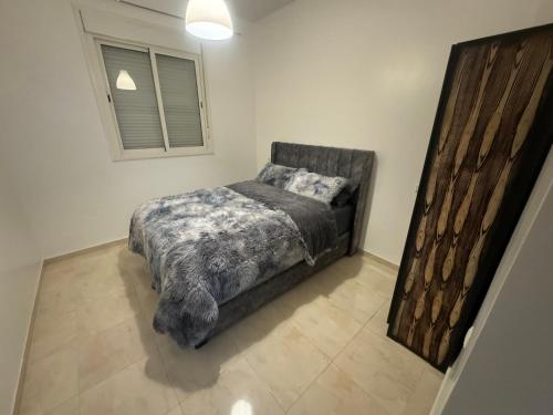 Postel nebo postele na pokoji v ubytování Joli Appartement à Marrakech calme