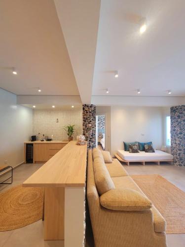 a living room with a couch and a table at Artis Blue Relax in Himare