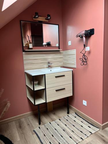 a bathroom with a sink and a mirror at Suite l Instant suspendu maison 25m2 avec coin salon Wifi Netflix Maison Like and Love Duclair in Duclair