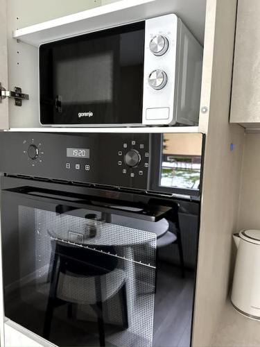 Kuchyň nebo kuchyňský kout v ubytování Vakariniai Apartamentai II