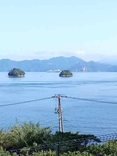 a view of a large body of water with islands at nagi-setouchi in Kure
